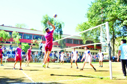 Players in action during a Volleyball match of Sports Tourney organized by DSW Cluster University in Jammu.
