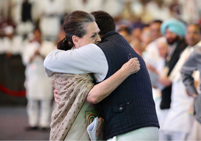 Congress president Rahul Gandhi hugs his mother and UPA chairperson Sonia Gandhi after addressing the party’s plenary session, in New Delhi on Saturday. (UNI)