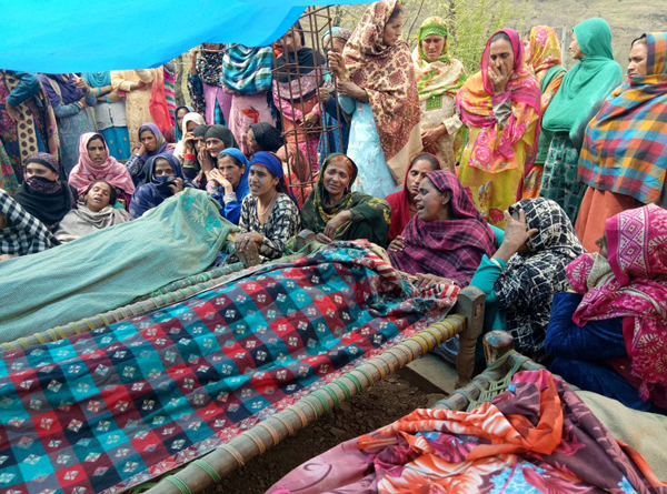 People wail over the bodies of Pakistan shelling victims at village Davitta in Balakote sector on Sunday. Another pic on page 6.