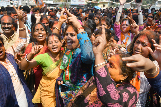 BJP supporters celebrating the party’s victory in Tripura Legislative Assembly election, in Agartala on Saturday. (UNI)