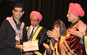 Governor N N Vohra awarding five Gold medals to Sachit Mahajan while Union Finance Minister Arun Jaitley and Chief Minister Mehbooba Mufti applause during 17th Convocation of JU on Sunday. —Excelsior/Rakesh