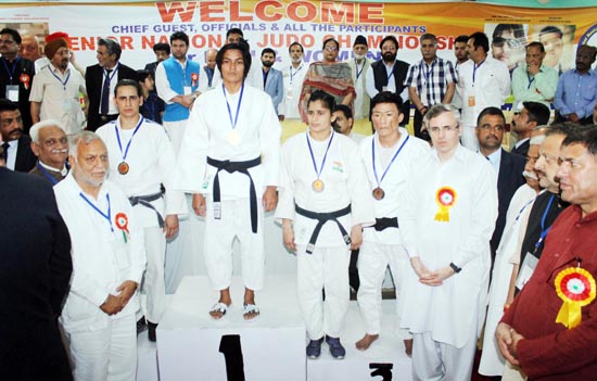 Judokas posing along with former Chief Minister Omar Abdullah and other dignitaries during concluding ceremony of Sr National Championship in Jammu.