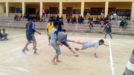 Catchers getting hold of raider during a Kabaddi match.