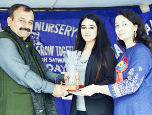 Chief guest being presented memento by the organizers during Annual Day.