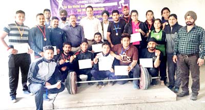 Weightlifters posing along with chief guest and other dignitaries after Competition in Jammu.