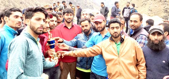 Winners of T20 Cricket Tournament posing along with the chief guest and other dignitaries at Drabshalla in Kishtwar.