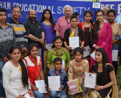 Students posing along with Minister for Health and Medical Education, Bali Bhagat during Annual Scholarship Distribution Function.