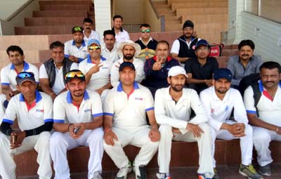 Teams of Aircel and Media posing for a group photograph at MA Stadium in Jammu.