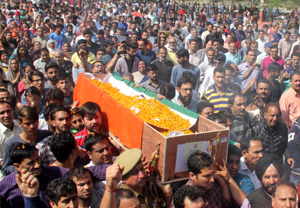 Sea of humanity taking body of martyr Deepak Kumar Thusoo for cremation at Jagti on Thursday. — Excelsior/Rakesh