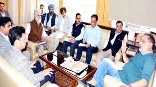 Finance Minister Dr Haseeb Drabu chairing a meeting at Jammu on Monday.