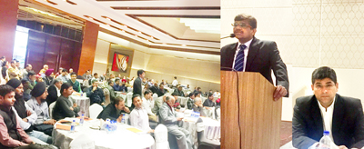 An expert briefing the traders on Market Outlook and Mutual Funds during a seminar in Jammu.