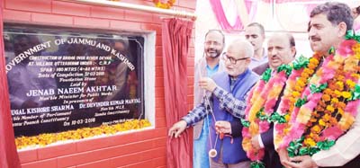Minister for Public Works, Naeem Akhtar laying foundation stone of bridge at Utterbehni on Saturday.