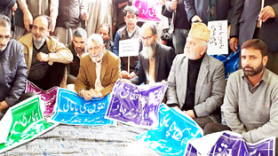 People protesting against shifting of Joint Director’s office at Sopore on Tuesday. -Excelsior/ Abid Nabi