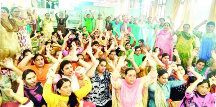 Female Multipurpose Health Workers staging protest in office chamber of Deputy CMO Jammu.