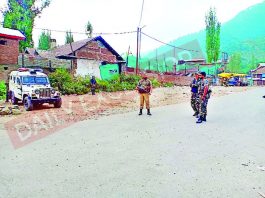 Troops at the site of encounter with militants at Kokernag in Anantnag on Friday. -Excelsior/Sajad Dar