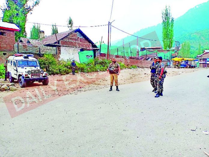 Troops at the site of encounter with militants at Kokernag in Anantnag on Friday. -Excelsior/Sajad Dar