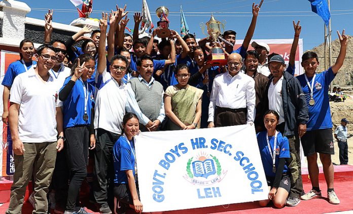 Winners of Ladakh School Olympics posing with Chief Secretary BVR Subrahmanyam during closing function of the event in Leh.