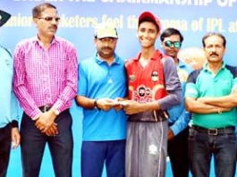 Mohd Aman receiving man of the match award from former Member BCCI and Working Committee Member JKCA Ankush Abrol at KC Sports Club in Jammu.