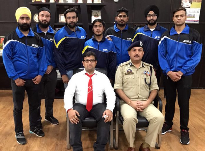 State Powerlifting men's Equipped team posing for a group photograph along with IGP Jammu, Dr SD Singh on Friday.