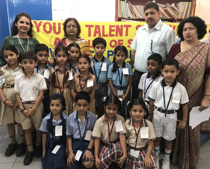 Winners of Inter-School Extempore competition posing for a group photograph along with dignitaries at Lawrence Public School in Jammu.