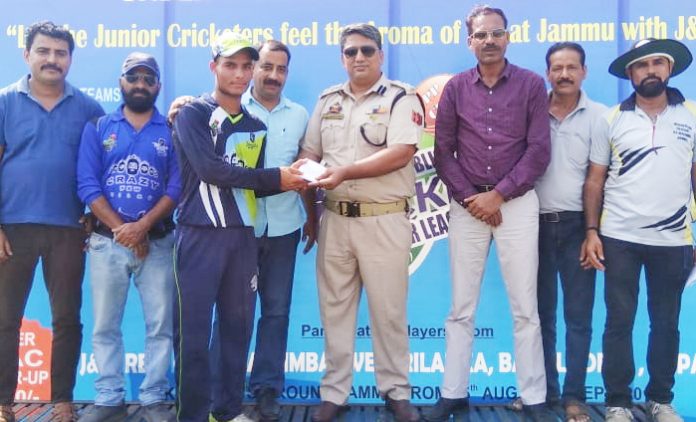 Former International Wrestler and SP Rural, Dushyant Sharma presenting man of the match award to Aqib of KC Royals at KC Sports Club in Jammu.