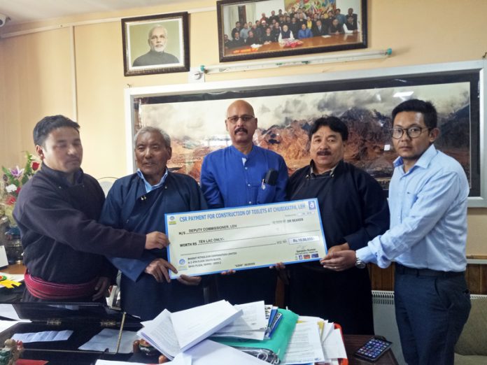 Regional Director, BPCL, Rajesh Sharma handing over a cheque of Rs 10 lakh to Dorjay Motup, CEC LAHDC in the presence of Executive Councilors.