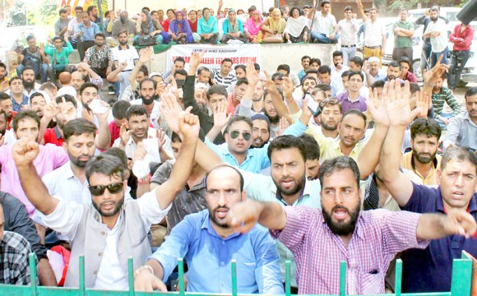 ReT teachers staging protest dharna near Press Club Jammu on Wednesday.