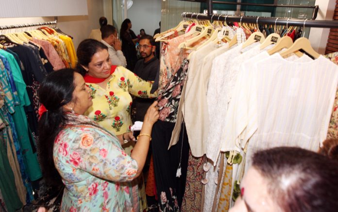 Customers having glimpses of the costumes at newly opened Abiti, Indo-Western Women Wear Showroom at 613-A, behind Laxmi Narayan Mandir, Gandhi Nagar Jammu. The showroom was inaugurated by Bharti Vaid, Chairperson, Police Wives Welfare Association (PWWA). —Excelsior/Rakesh