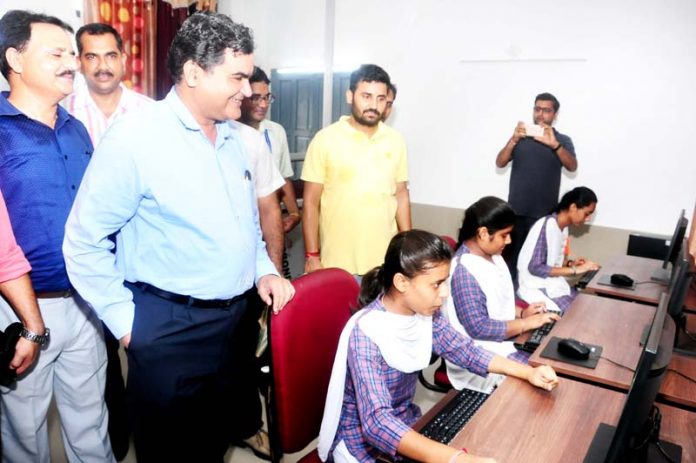 J P Singh, Executive Director Powergrid handing over computers to Government GMHSS Samba on Friday.