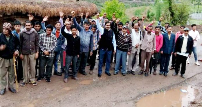 Locals protesting for repair of Ramnagar to Basantgarh road.