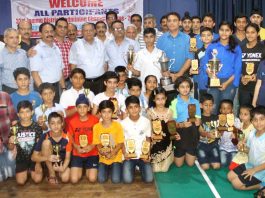 Winners of 23rd Jammu District Badminton Championship posing along with chief guest and other dignitaries at Police Lines Badminton Hall in Jammu.