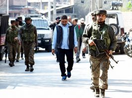 NIA team on way to raid house of a businessman in Srinagar on Tuesday. -Excelsior/Shakeel