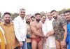 Former Minister Mula Ram inaugurating a bout during wrestling competition at Bantalab Jammu on Sunday.