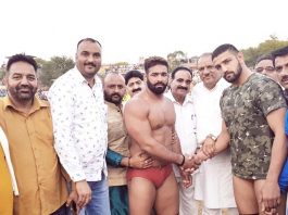 Former Minister Mula Ram inaugurating a bout during wrestling competition at Bantalab Jammu on Sunday.