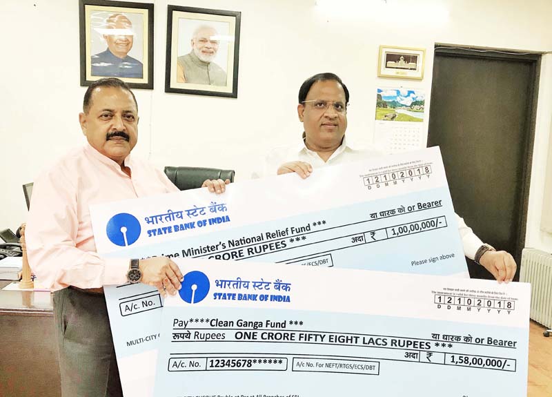 Union Minister Dr Jitendra Singh receiving two cheques worth Rs.2.58 crore as funds contributed by the Haryana Commerce & Industries Minister, Vipul Goel, on Saturday.