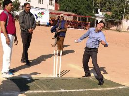 Divisional Commissioner Sanjeev Verma testing his bowling skills in a match organized during ongoing 7th Eid-Diwali Milan Cricket Cup at Parade Ground Jammu on Tuesday.