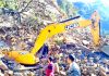 An earth-moving machine at the site of a landslide, which left at least seven labourers dead in Uttarakhand’s Rudraprayag district on Friday.
