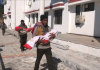 Family members carrying dead bodies of two minor sisters, who dies because of unknown disease in Reasi district on Saturday.