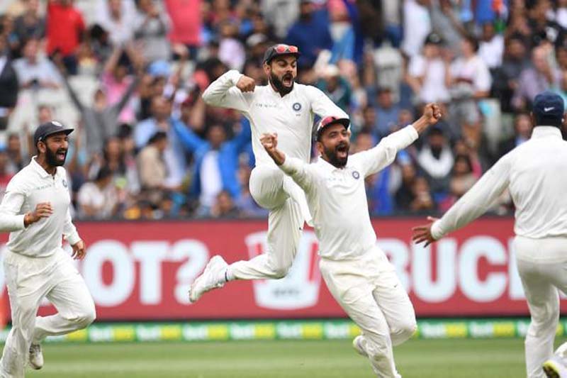 Captain Virat Kohli, Pujara and Rahane celebrate after winning the third test match against Australia at the MCG in Melbourne.