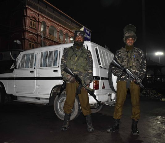 Security forces alert outside a CRPF installation after militants hurled grenade at Lal Chowk in Srinagar. -Excelsior/Shakeel