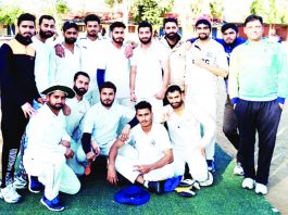 Winners posing along with officials during a match of New Year Cricket Cup 2019 Akhnoor on Monday.