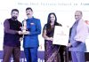 Rohit Gupta & Mona Gupta receiving award at New Delhi.
