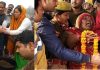 Relatives performing last rites of martyred CRPF jawan Ram Wakeel in Mainpuri (L) and grieving relatives of Avadhesh Yadav during his last rites in Chandauli on Saturday. (UNI)