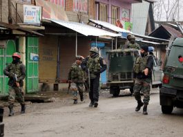 Security forces during encounter in Warpora, Sopore on Friday.