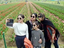 Visitors at Asia’s largest Tulip Garden in Srinagar on Sunday. —Excelsior/Shakeel