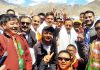 Union Minister Dr Jitendra Singh, flanked by BJP State president Ravinder Raina and senior party leaders, on arrival at Leh, on Monday.