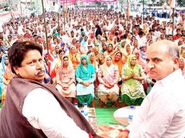 Senior Cong leader Raman Bhalla flanked by ex-DyCM Tara Chand at an election rally in Khour on Sunday.