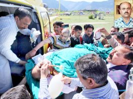 RSS functionary Chanderkant Sharma being shifted in helicopter at Kishtwar for airlifting to Jammu on Tuesday. (Inset) file photo of martyr Chanderkant. -Excelsior/Rakesh