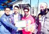 Memento presentation during the inaugural ceremony of Mehboob-ul Alam T20 tourney in Srinagar.
