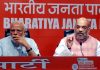 Prime Minister Narendra Modi with BJP national president Amit Shah addressing a press conference at BJP headquarters, in New Delhi on Friday. (UNI)